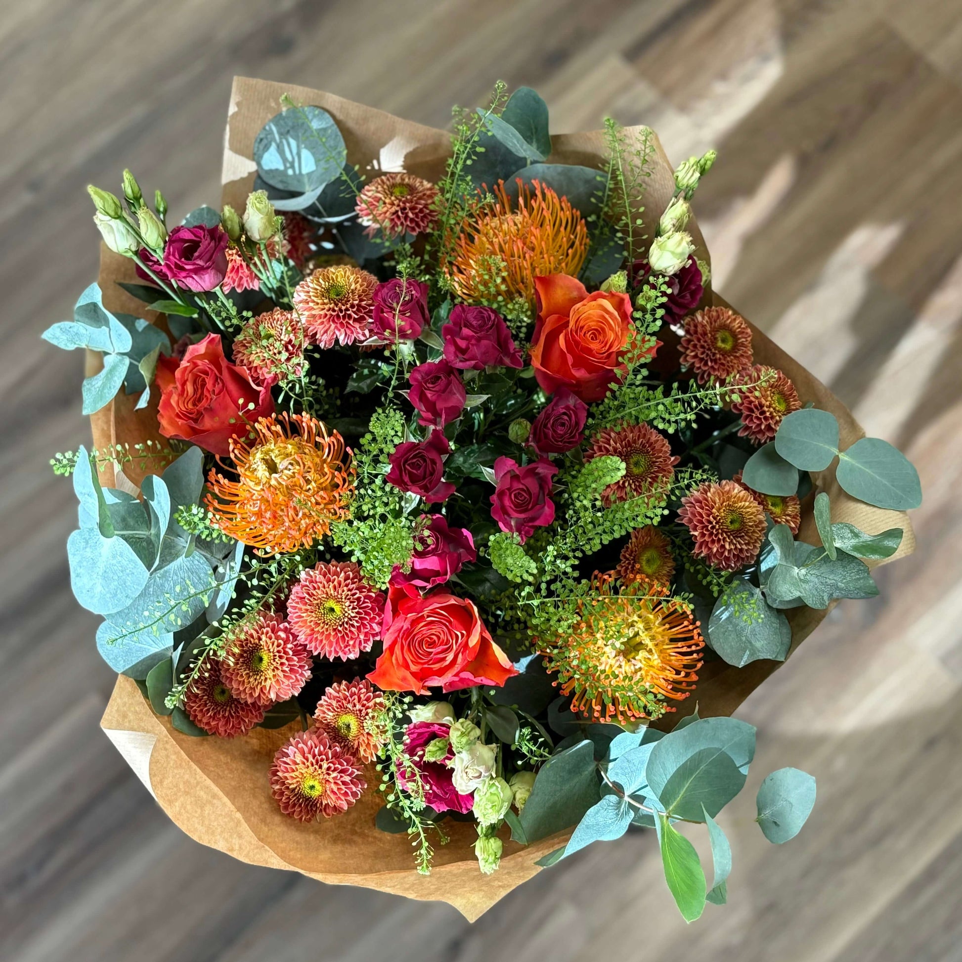 bright vibrant flowers colourful orange tropical cerise purple green yellow mixed bouquet vase