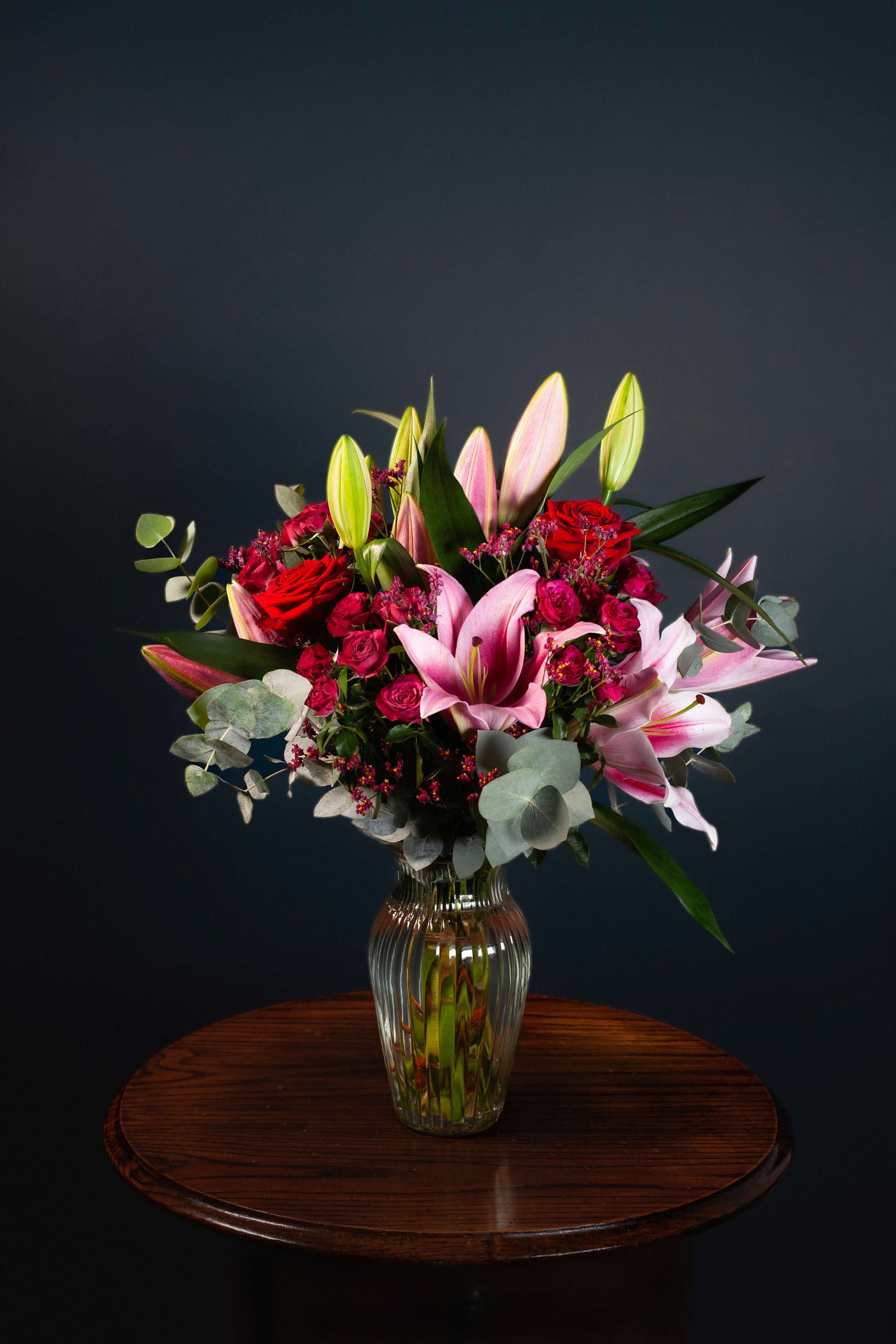 red pink burgundy flowers romantic anniversary birthday floral arrangement roses lilies bouquet